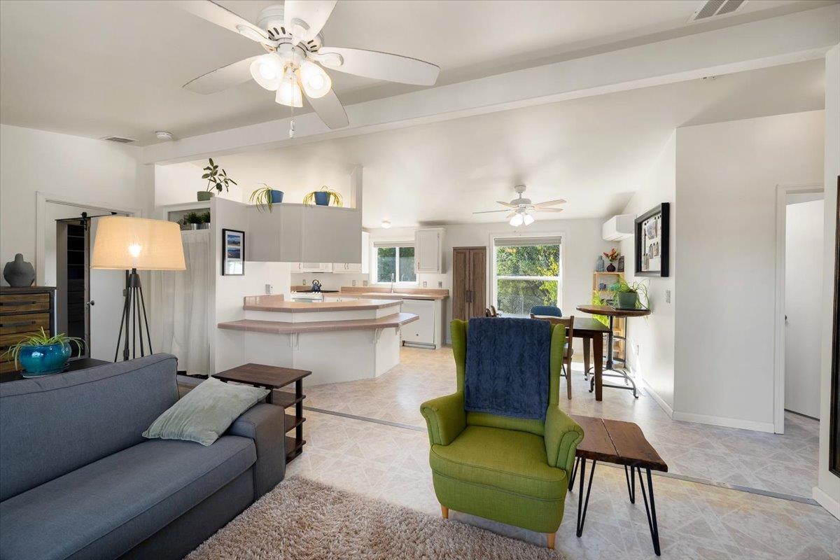 7155 Stewart Mine Road Placerville, CA 95667 - Photo 10 of 68 a living room with furniture and a dining table with kitchen view