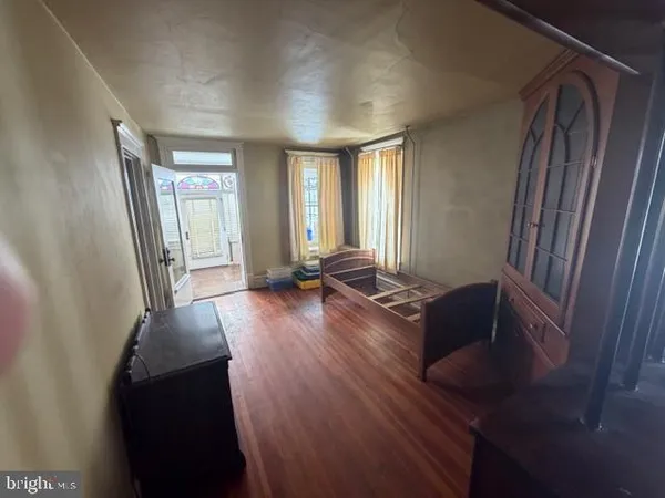 a bed room with a bed and a window