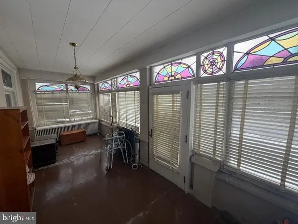 a kitchen with stainless steel appliances a white refrigerator a sink and white cabinets