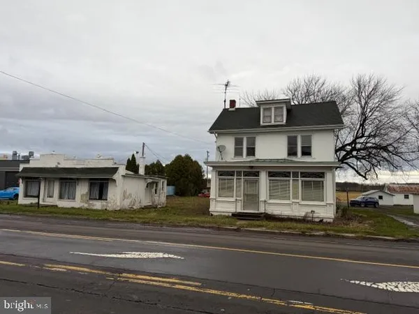 a view of a white building among the street