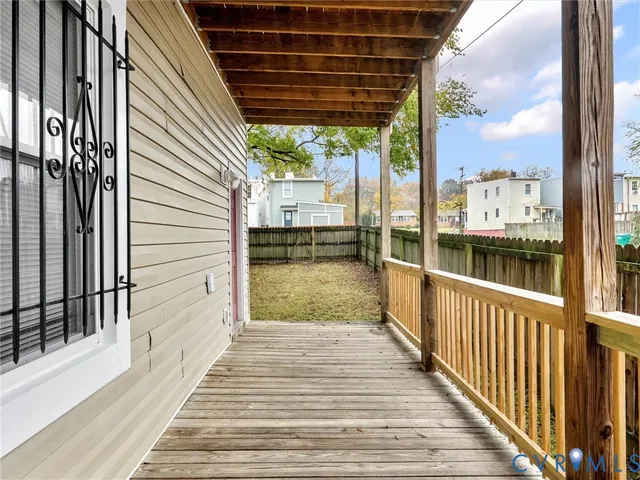 a view of balcony with wooden floor