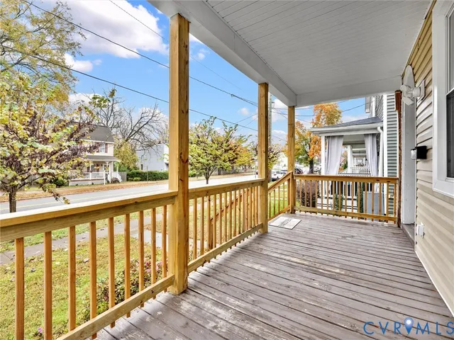 a view of a balcony with wooden floor