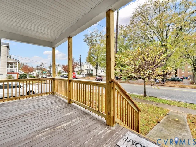 a view of a balcony with wooden floor