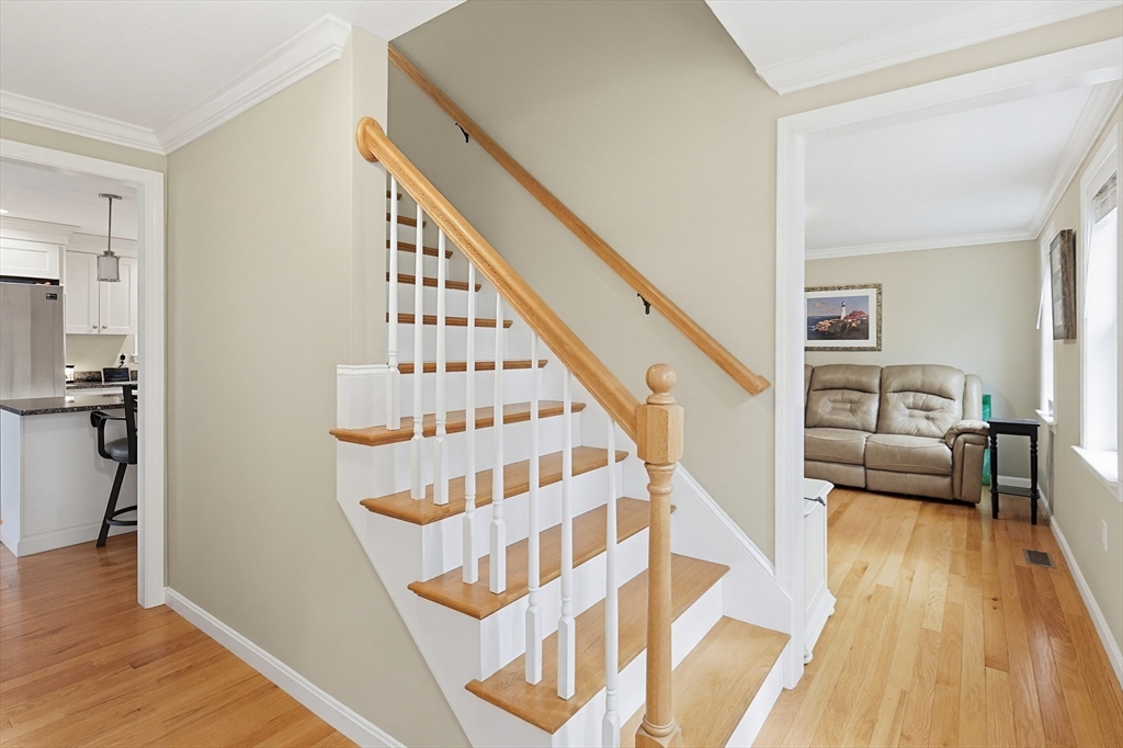 24 Reservoir Road Pembroke, MA 02359 - Photo 15 of 42 a view of entryway livingroom and hall with wooden floor
