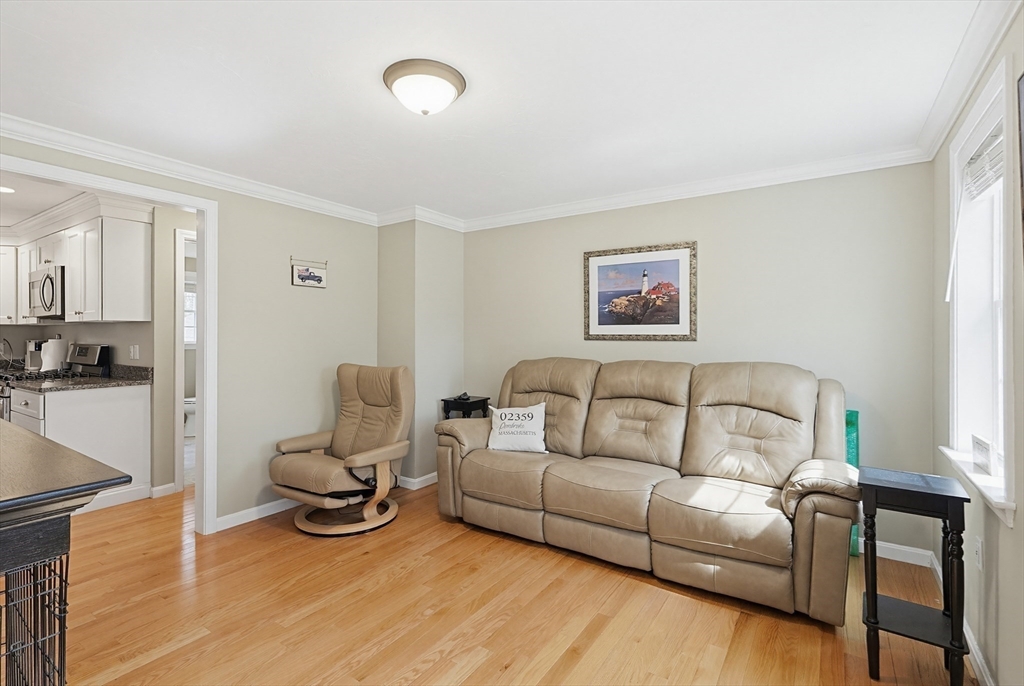 24 Reservoir Road Pembroke, MA 02359 - Photo 16 of 42 a living room with furniture and a couch