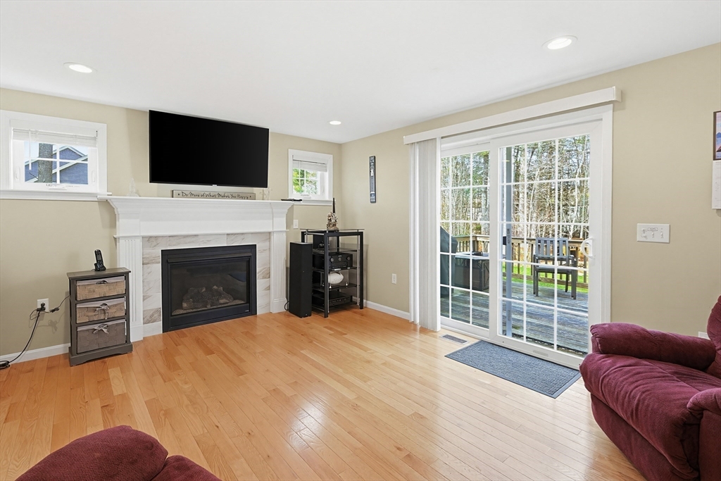 24 Reservoir Road Pembroke, MA 02359 - Photo 18 of 42 a view of a livingroom with a fireplace