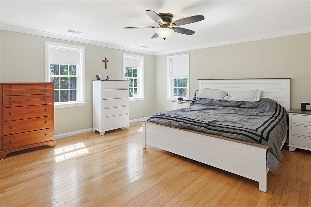 24 Reservoir Road Pembroke, MA 02359 - Photo 22 of 42 a bedroom with a bed and a dresser