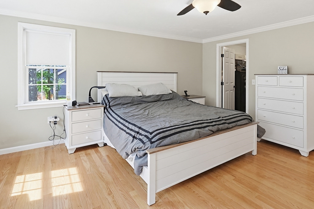 24 Reservoir Road Pembroke, MA 02359 - Photo 23 of 42 a bedroom with a bed and window