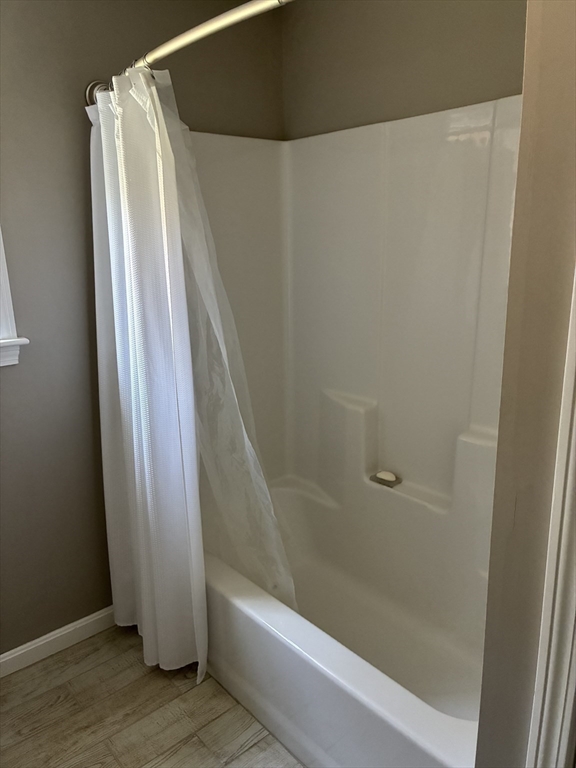24 Reservoir Road Pembroke, MA 02359 - Photo 28 of 42 a bathroom with a shower and a tub
