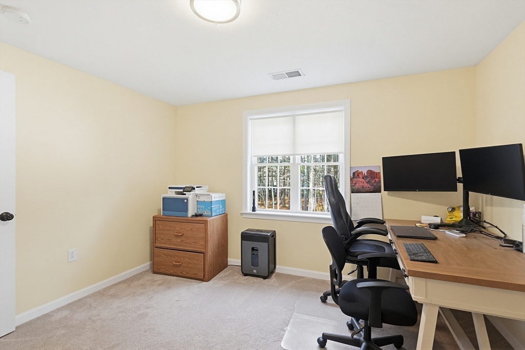 24 Reservoir Road Pembroke, MA 02359 - Photo 29 of 42 a view of a workspace with furniture and a window