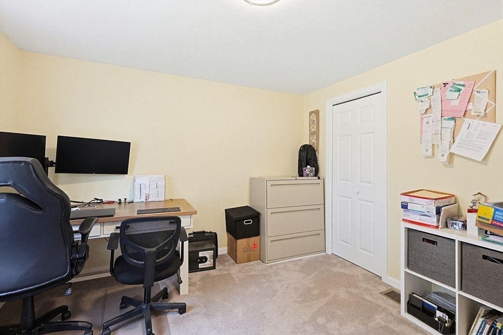 24 Reservoir Road Pembroke, MA 02359 - Photo 30 of 42 a view of a workspace with furniture and a window