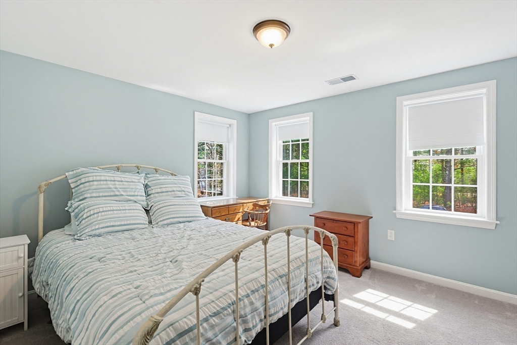 24 Reservoir Road Pembroke, MA 02359 - Photo 31 of 42 a bedroom with a bed and window