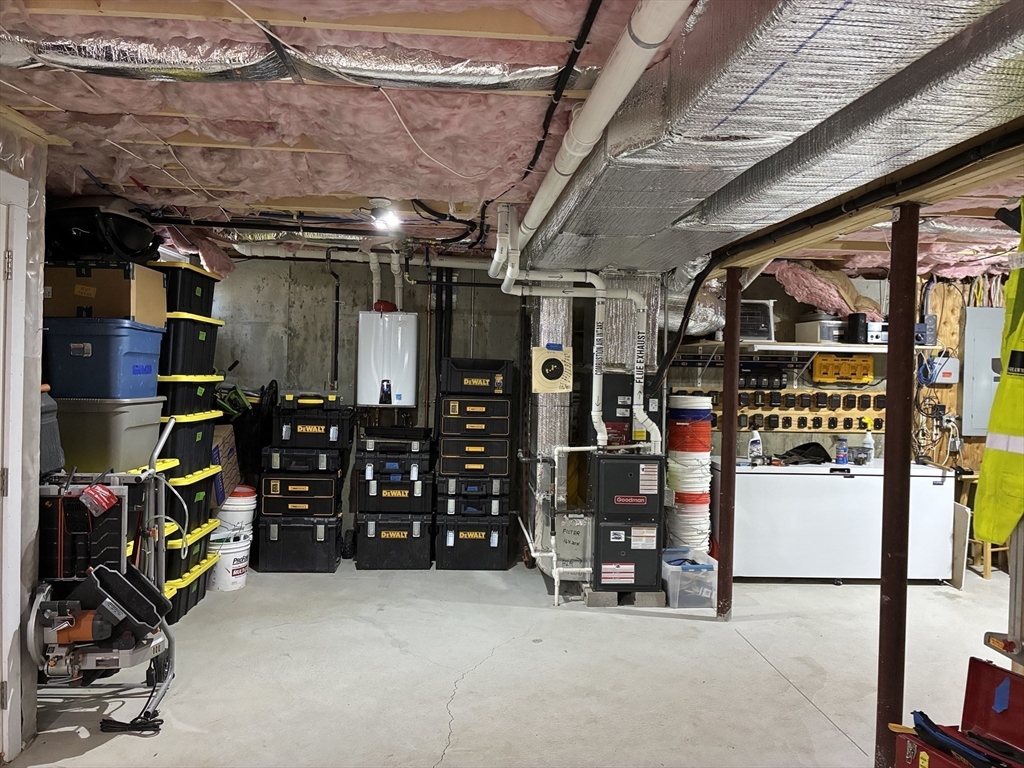 24 Reservoir Road Pembroke, MA 02359 - Photo 33 of 42 a view of a storage room with racks