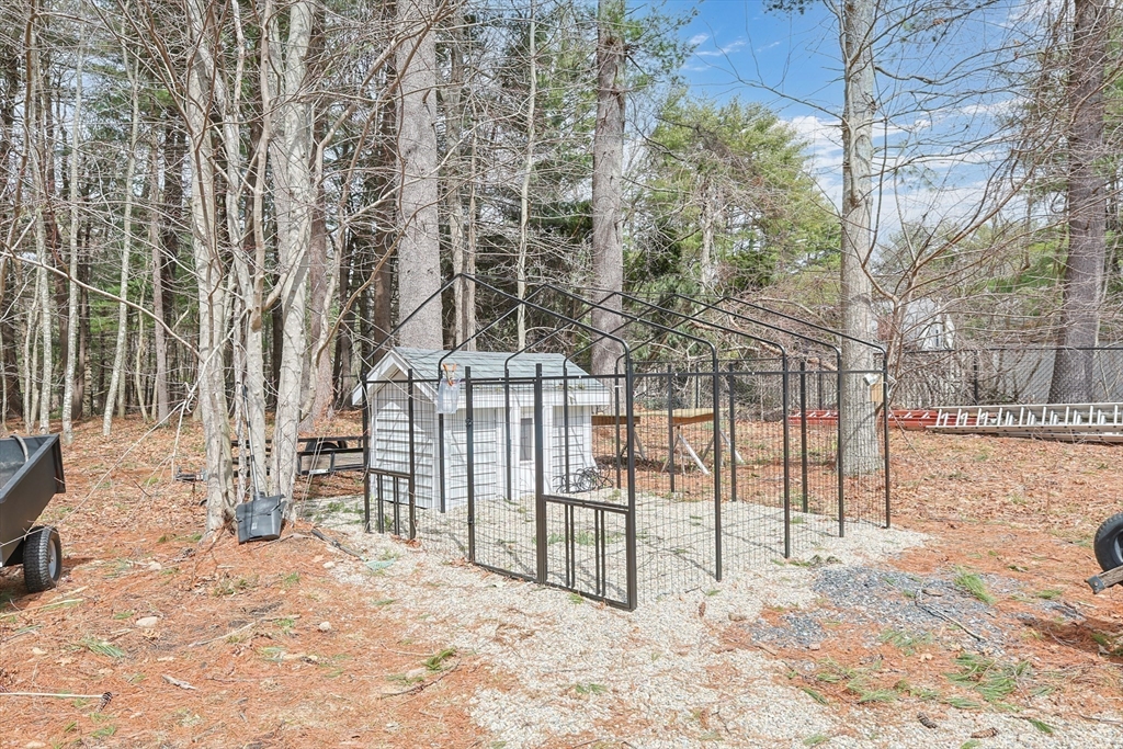 24 Reservoir Road Pembroke, MA 02359 - Photo 41 of 42 a view of a yard covered in snow