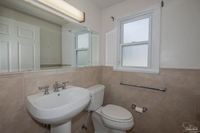 a view of a big room with wooden floor and closet area