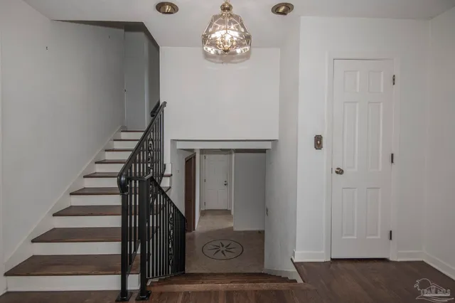 a view of workspace with wooden floor windows