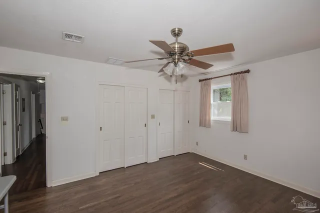 a kitchen with stainless steel appliances granite countertop a sink and dishwasher with wooden cabinets