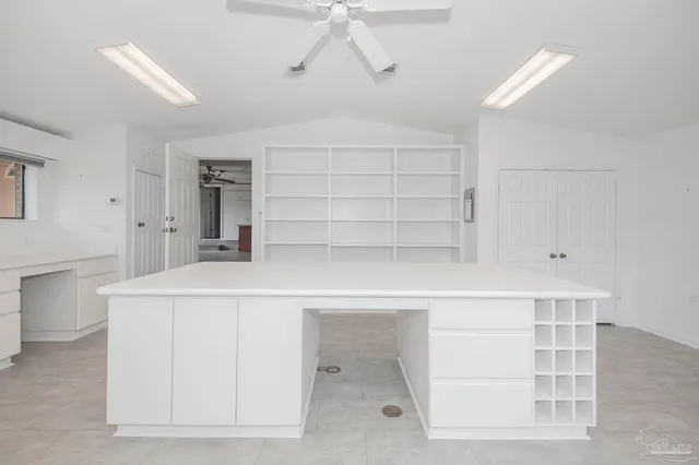 a front view of a house with a yard and a garage