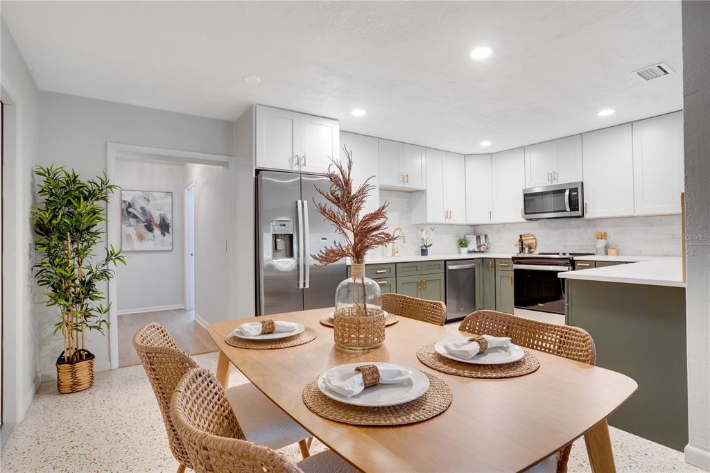 5135 101st Street North St. Petersburg, FL 33708 - Photo 11 of 46 a kitchen with furniture and a dining table