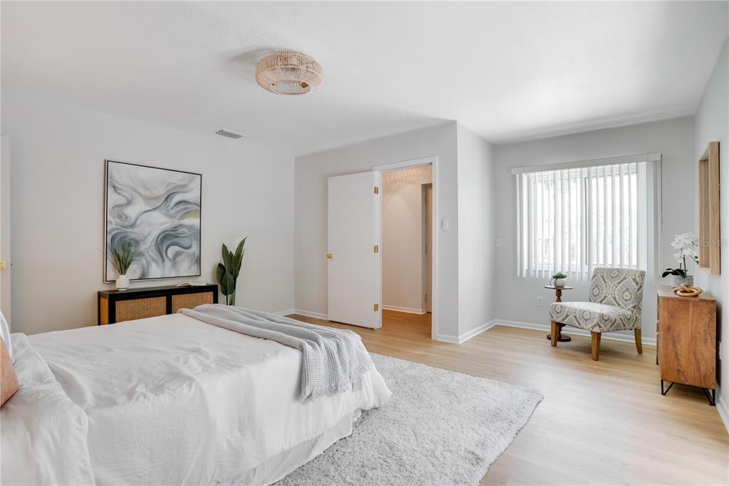 5135 101st Street North St. Petersburg, FL 33708 - Photo 19 of 46 a bedroom with a bed and furniture