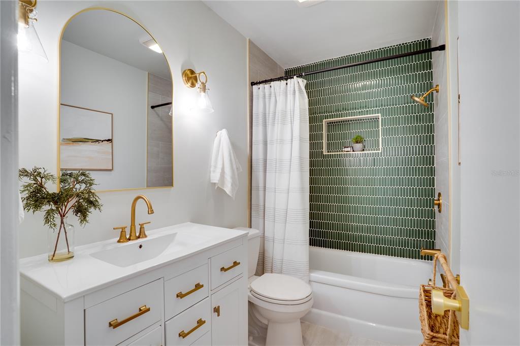 5135 101st Street North St. Petersburg, FL 33708 - Photo 29 of 46 a bathroom with a sink toilet and shower