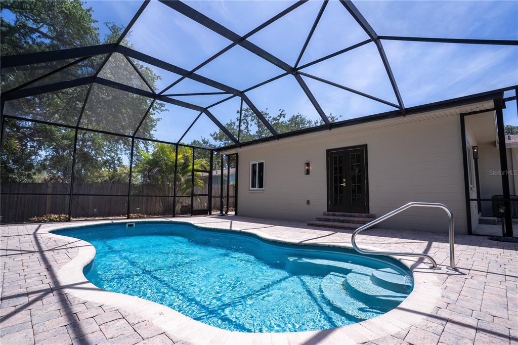 5135 101st Street North St. Petersburg, FL 33708 - Photo 33 of 46 a backyard of a house with table and chairs