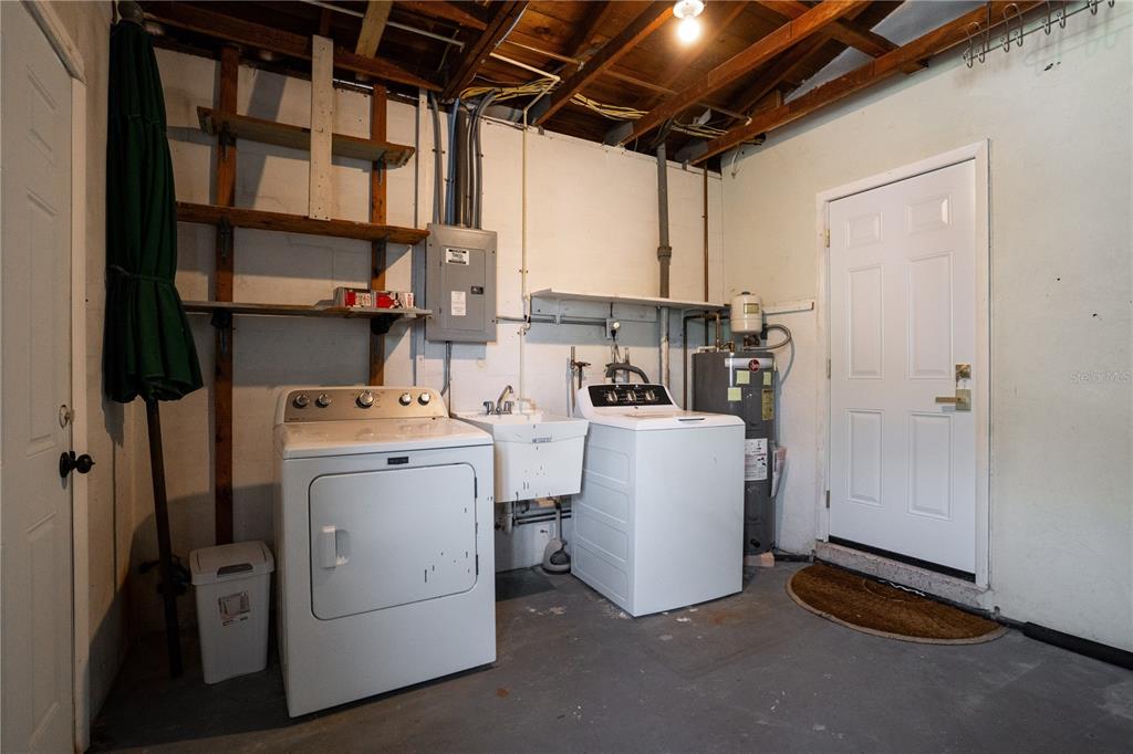 5135 101st Street North St. Petersburg, FL 33708 - Photo 41 of 46 a view of storage and utility room with washer and dryer