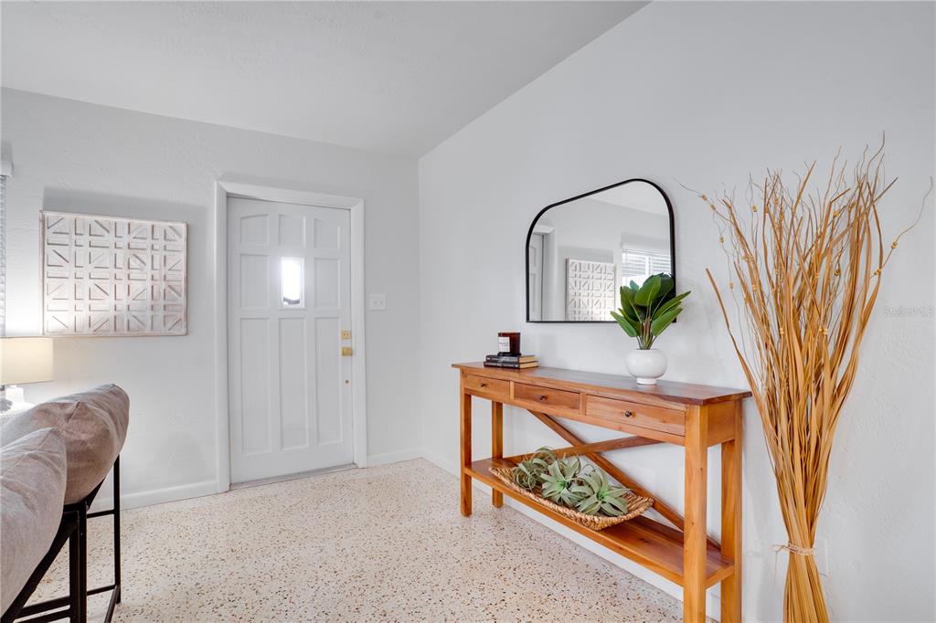 5135 101st Street North St. Petersburg, FL 33708 - Photo 6 of 46 a living room with furniture and a potted plant