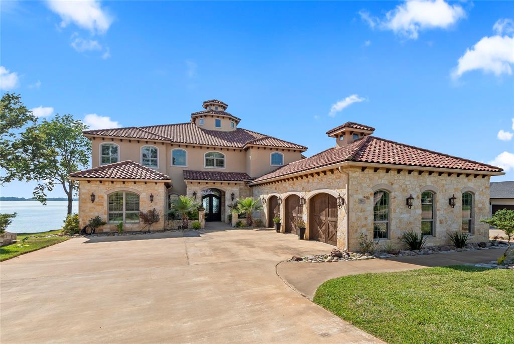 204 Pinnacle Club Place Mabank, TX 75156 - Photo 1 of 40 a front view of a house with a garden