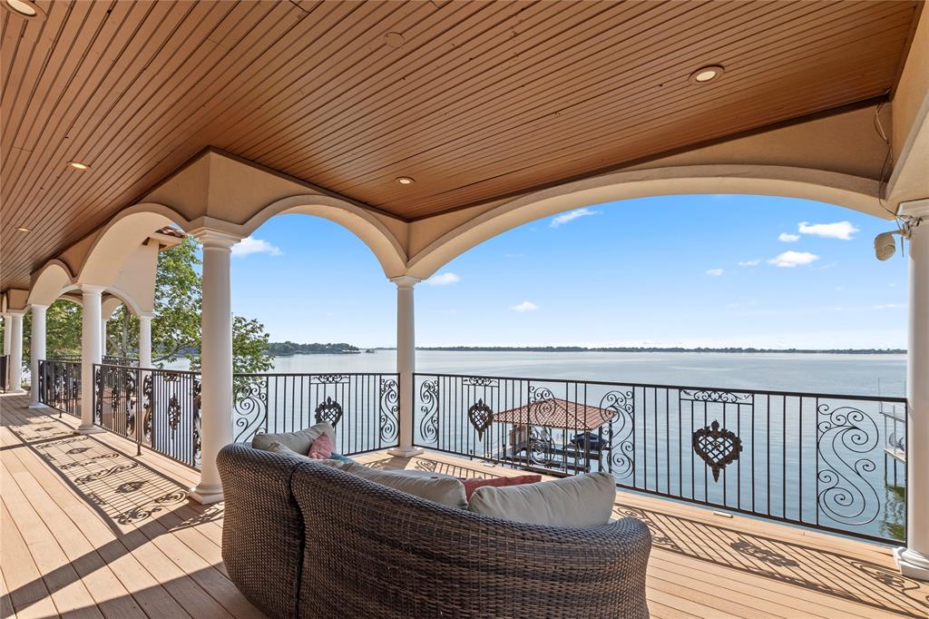 204 Pinnacle Club Place Mabank, TX 75156 - Photo 23 of 40 a roof deck with table and chairs