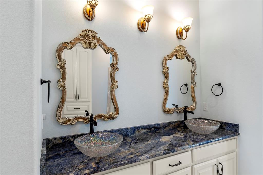 204 Pinnacle Club Place Mabank, TX 75156 - Photo 25 of 40 a bathroom with a granite countertop sink and a mirror