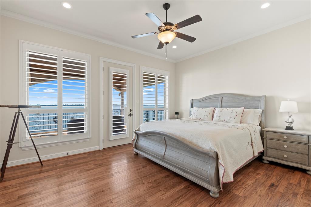 204 Pinnacle Club Place Mabank, TX 75156 - Photo 27 of 40 a bedroom with a bed and a flat tv screen on a dresser