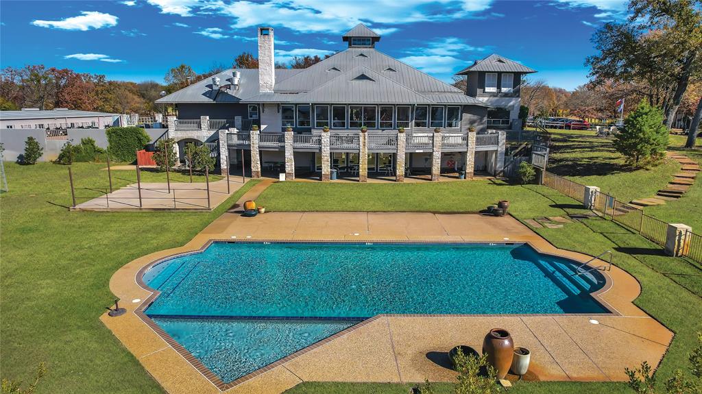 204 Pinnacle Club Place Mabank, TX 75156 - Photo 40 of 40 a view of a house with a swimming pool
