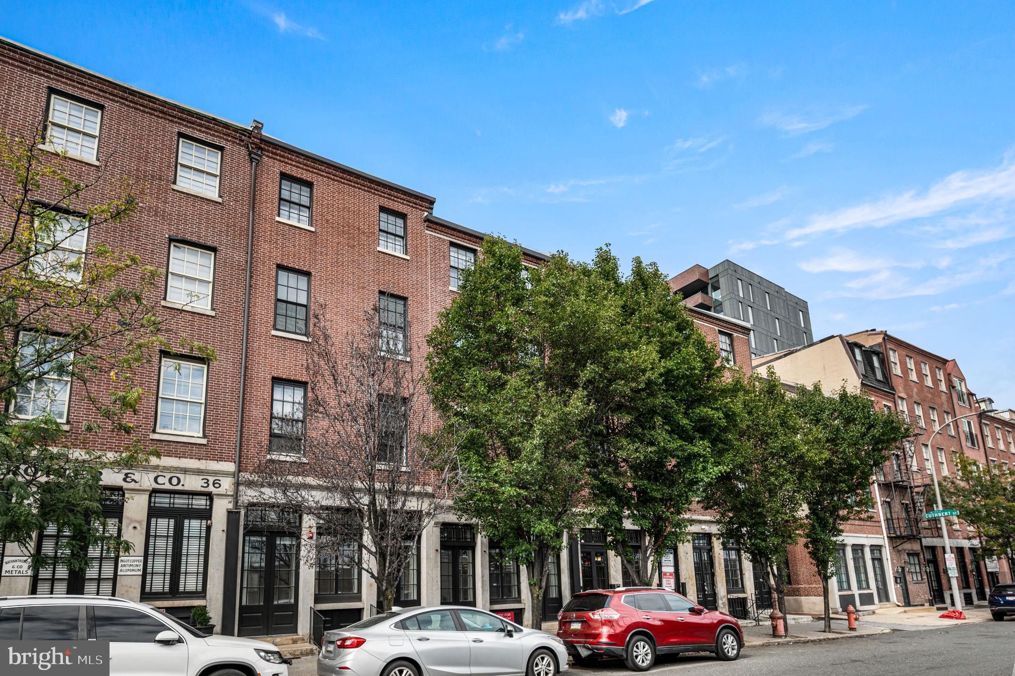 38 North Front Street, Unit 1F Philadelphia, PA 19106 - Photo 1 of 12 a front view of a building with trees