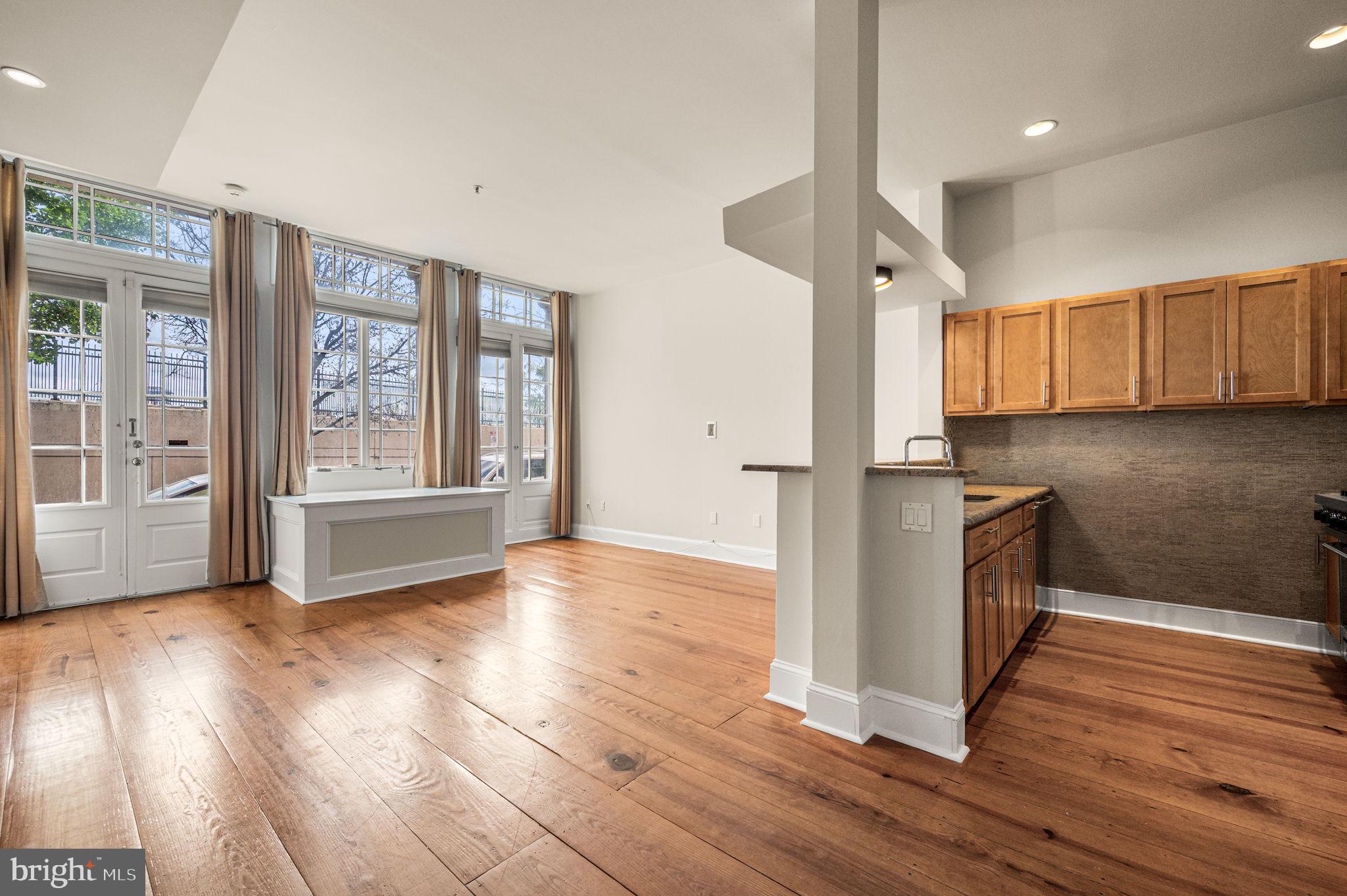 38 North Front Street, Unit 1F Philadelphia, PA 19106 - Photo 2 of 12 a view of kitchen with wooden floor and electronic appliances