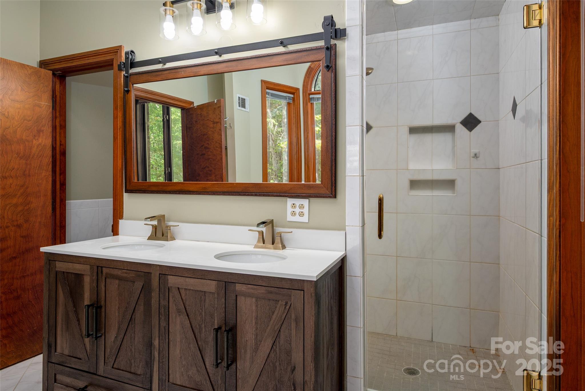 909 Baron Road Waxhaw, NC 28173 - Photo 22 of 46 a bathroom with a sink and a mirror