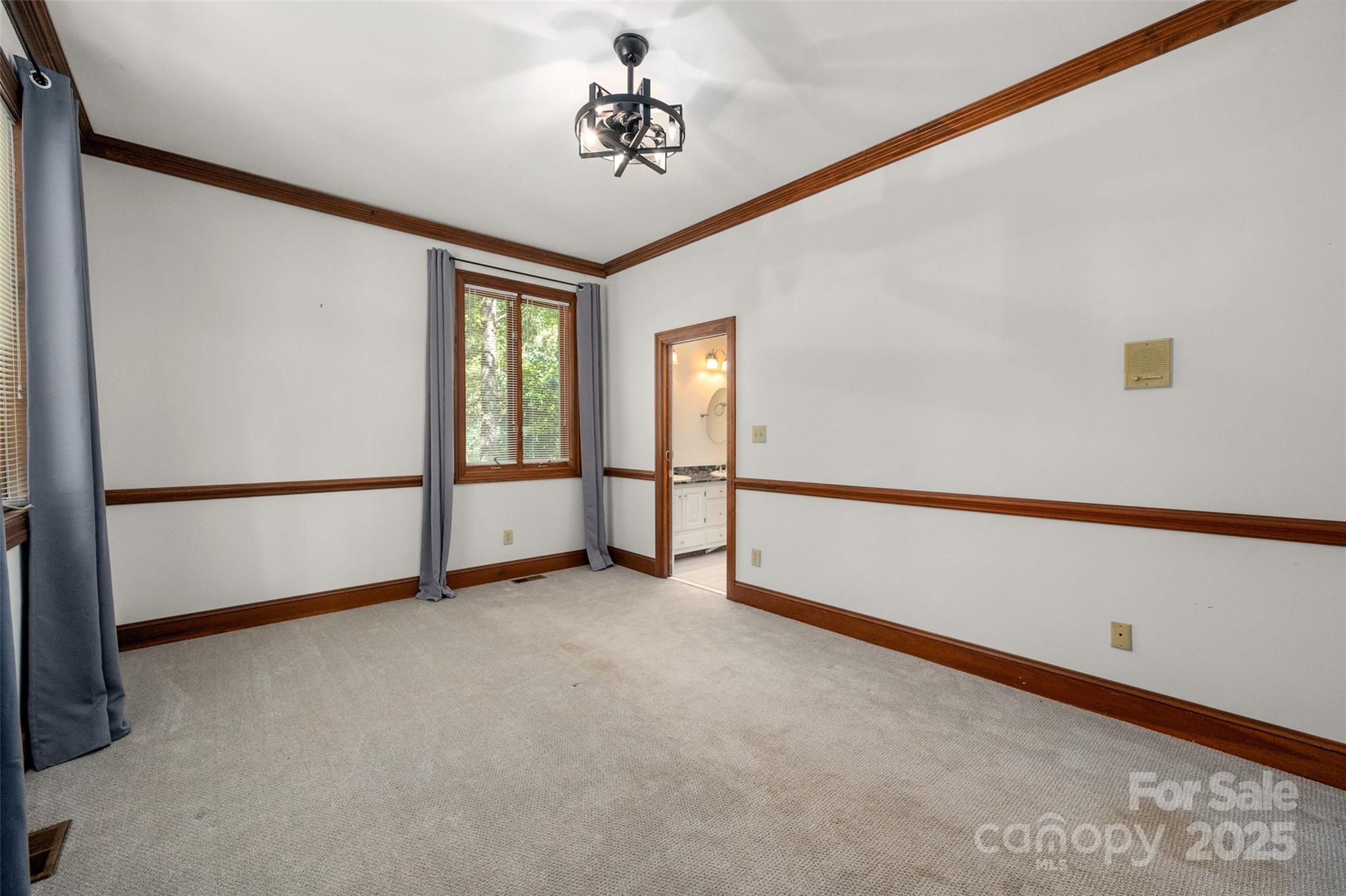 909 Baron Road Waxhaw, NC 28173 - Photo 24 of 46 a view of an empty room with a window