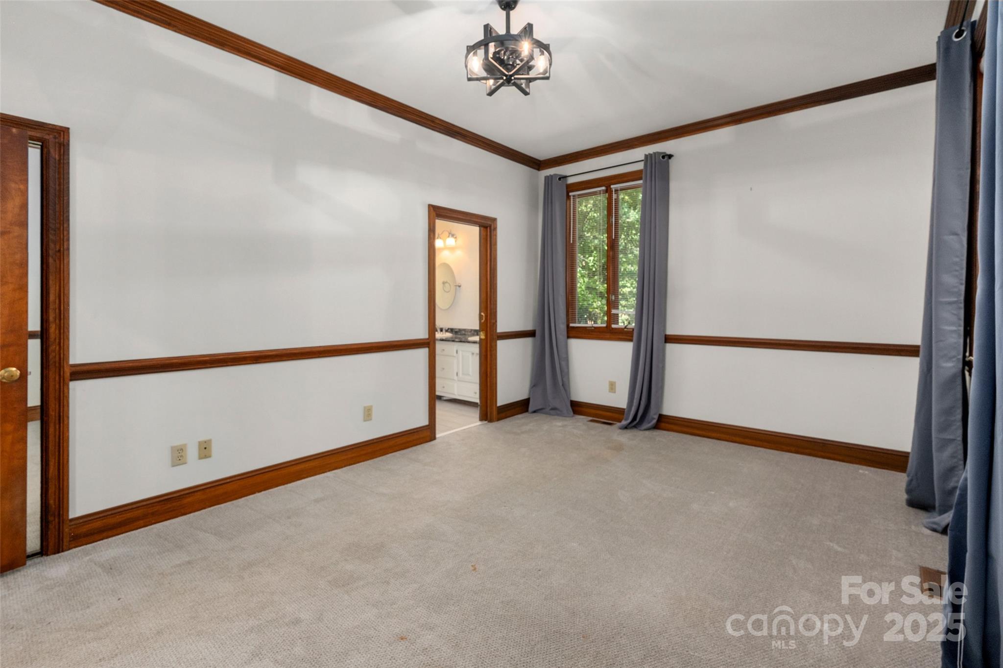 909 Baron Road Waxhaw, NC 28173 - Photo 28 of 46 a view of an empty room with a window
