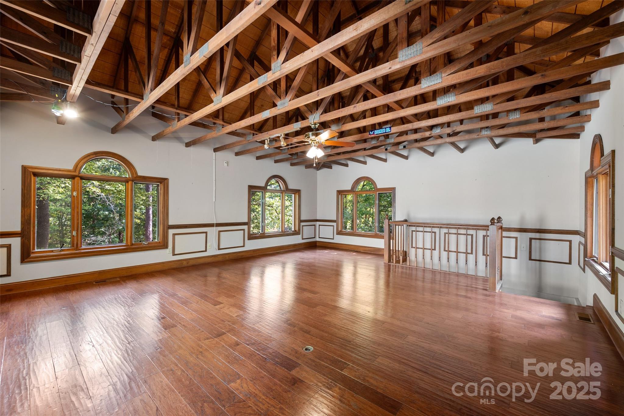 909 Baron Road Waxhaw, NC 28173 - Photo 29 of 46 a view of an empty room with wooden floor