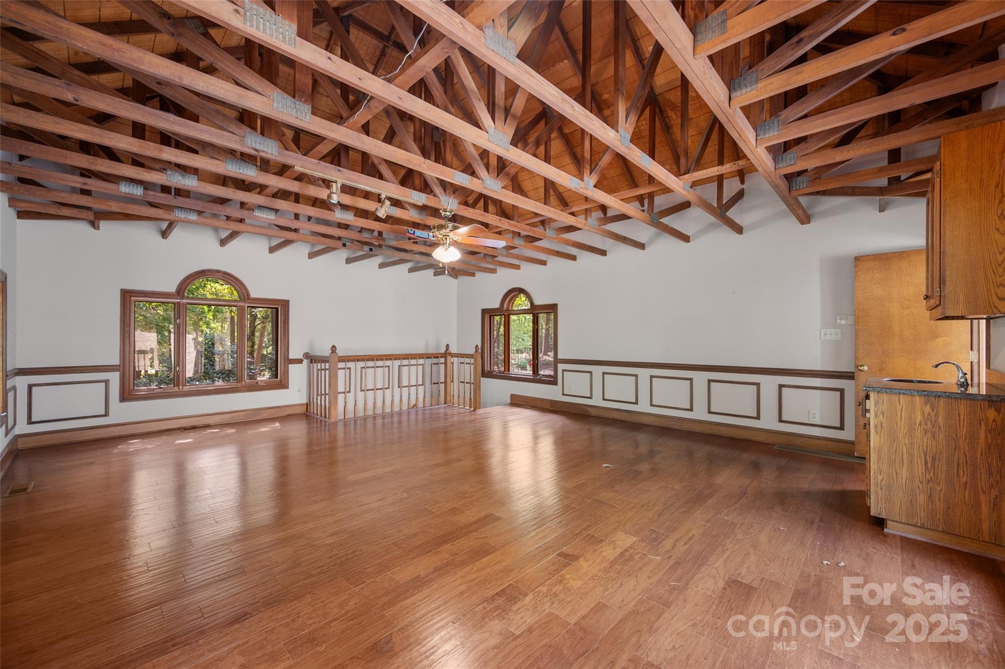 909 Baron Road Waxhaw, NC 28173 - Photo 30 of 46 a view of an empty room with wooden floor