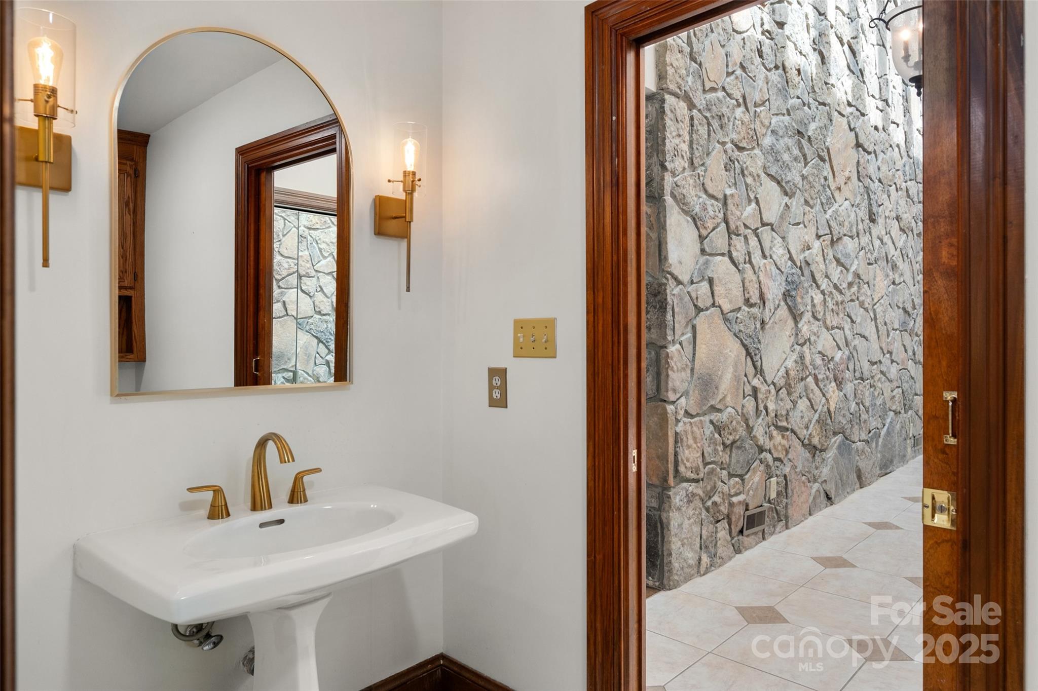 909 Baron Road Waxhaw, NC 28173 - Photo 32 of 46 a bathroom with a sink and a mirror