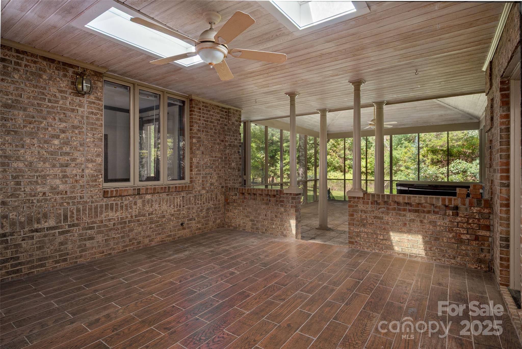 909 Baron Road Waxhaw, NC 28173 - Photo 38 of 46 a view of empty room with wooden floor and fan