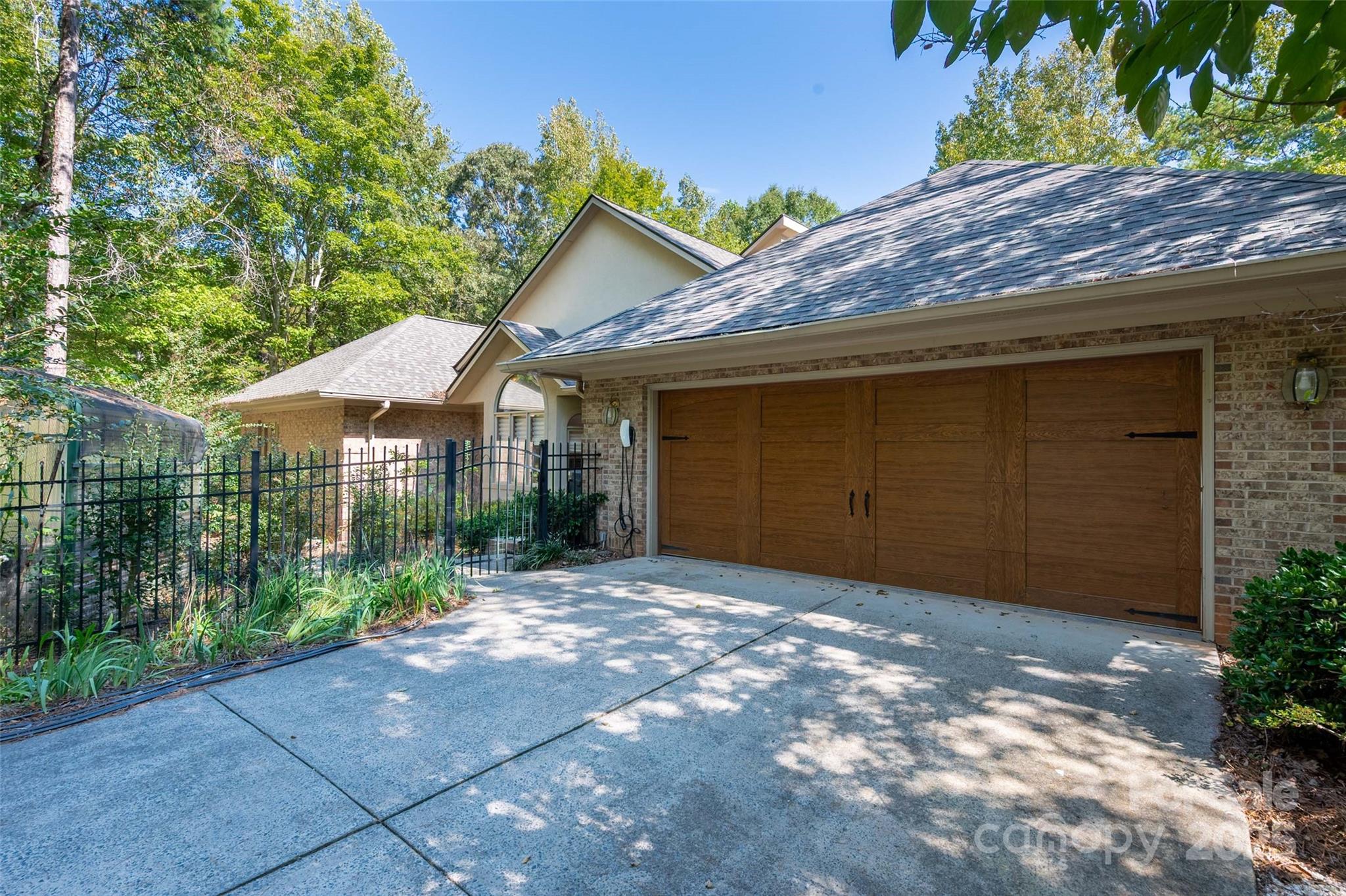 909 Baron Road Waxhaw, NC 28173 - Photo 41 of 46 a view of a house with a yard