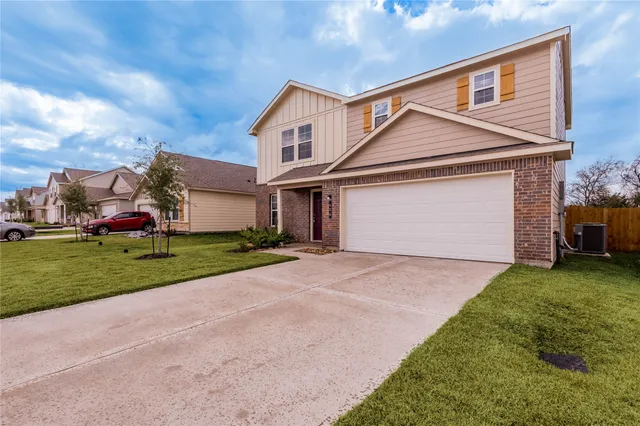 a view of a backyard with wooden fence