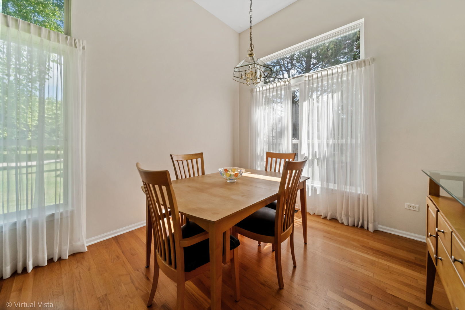 224 Willow Bend Bolingbrook, IL 60490 - Photo 11 of 41 a view of a dining room with furniture window and wooden floor