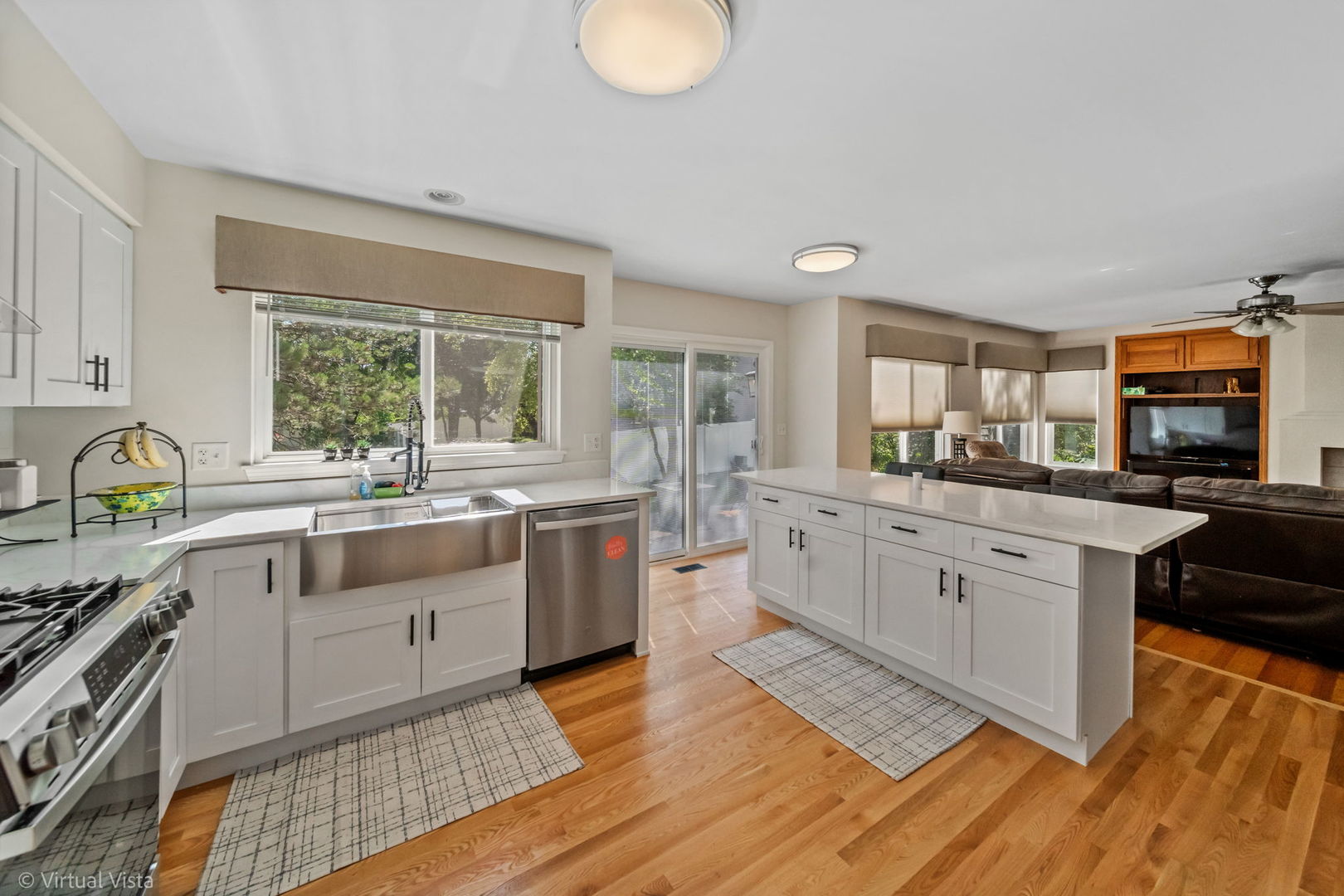 224 Willow Bend Bolingbrook, IL 60490 - Photo 14 of 41 a kitchen with stainless steel appliances granite countertop a stove a sink dishwasher and white cabinets with wooden floor