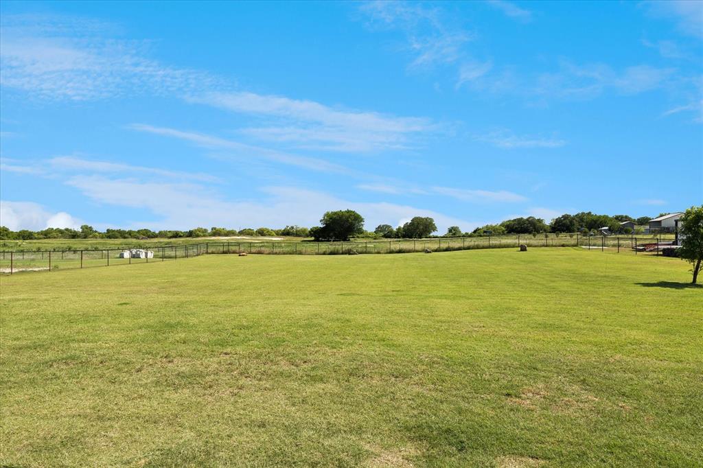 112 Friendship Way Boyd, TX 76023 - Photo 26 of 29 Expansive green lawn with perimeter fencing