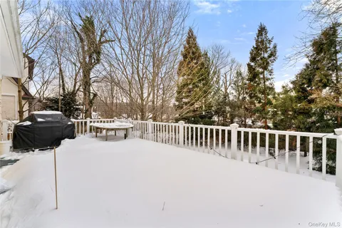 a view of balcony with wooden fence and trees