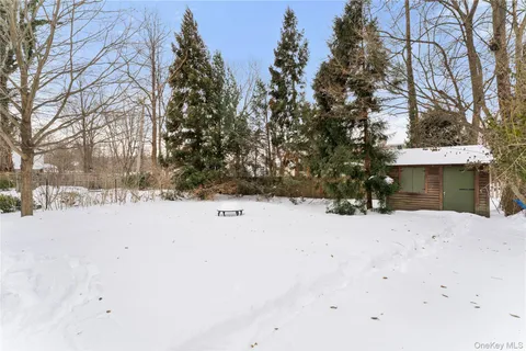 a view of snow on the side of a road