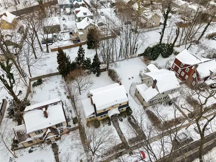 a view of backyard of a house with outdoor seating